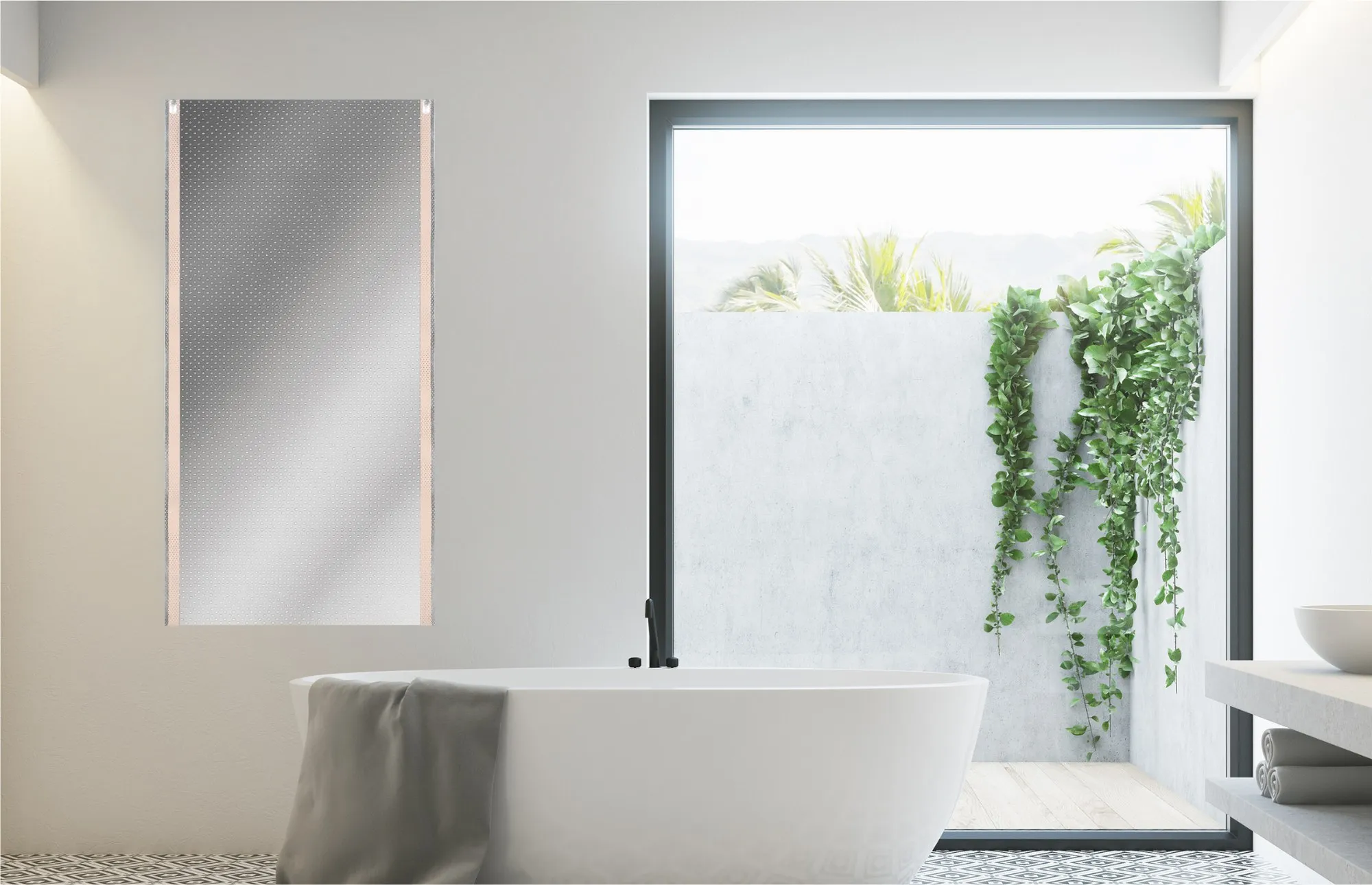 A bright bathroom with a freestanding bath, a window onto planting, and a ComfortScrim heating element on the wall before it is plastered over