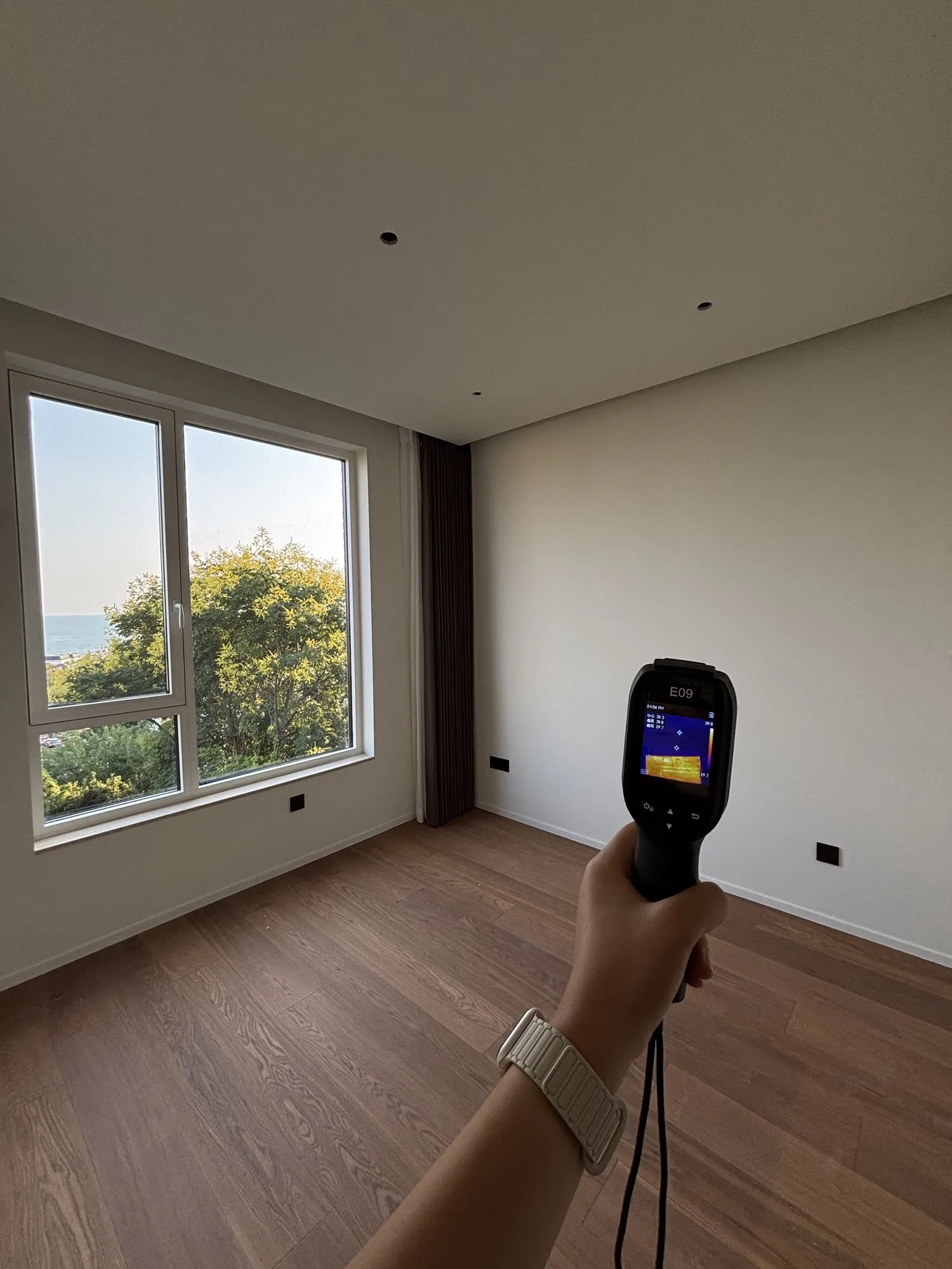 A thermal camera in a bedroom with a view of the sea